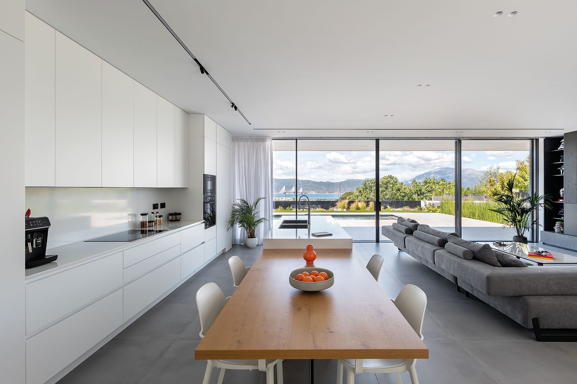 Residence in Achaia kitchen and dining area opening to the Gulf of Patras