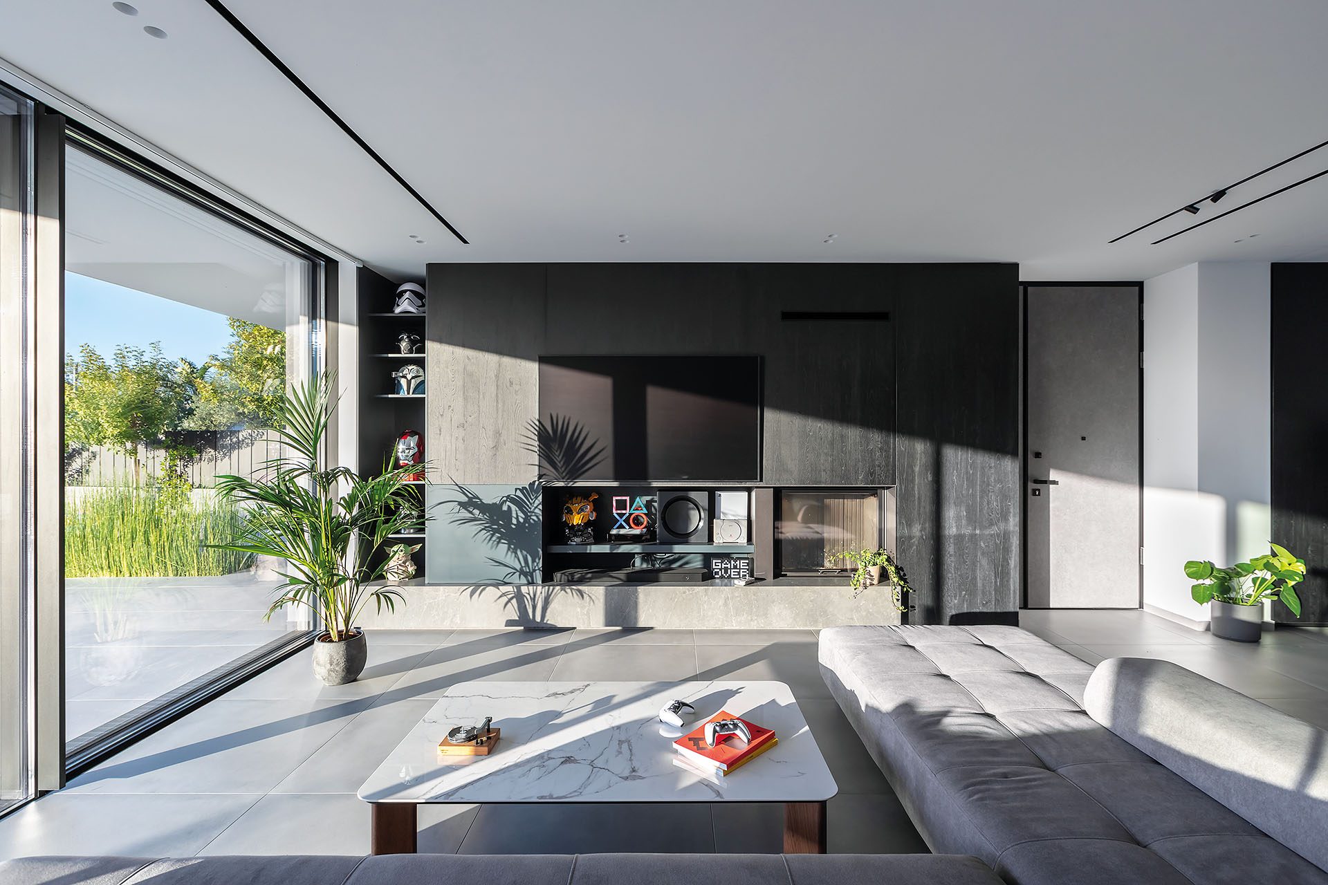 Residence in Achaia living room with full-height glazing towards the garden