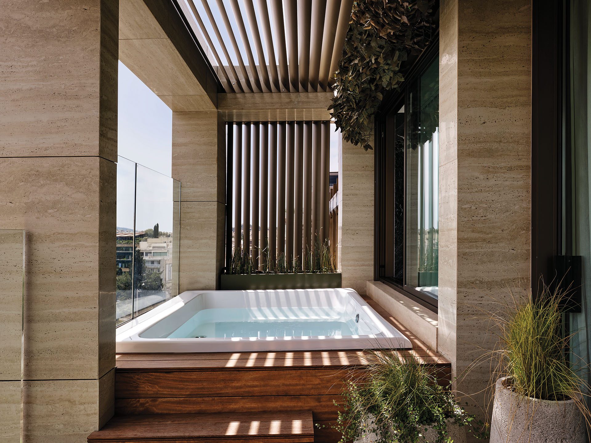 Private terrace with jacuzzi and timber screen at Anthology of Athens