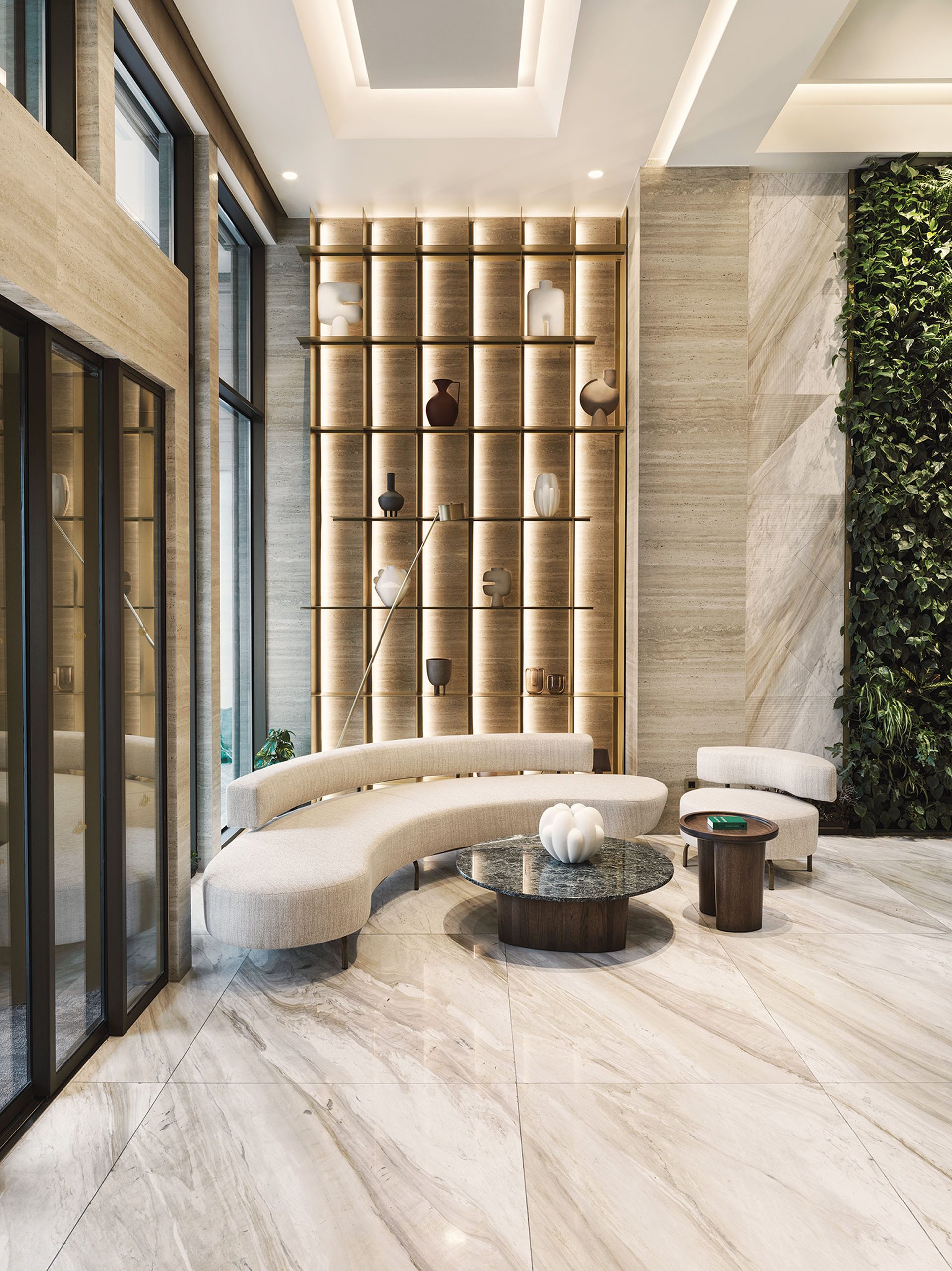 Anthology of Athens lounge with curved sofa and backlit oak shelving