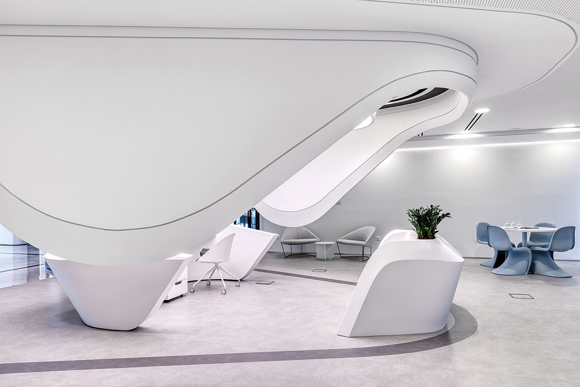 White sculptural reception and lounge of Beat headquarters by Lianou Chalvatzis Architects