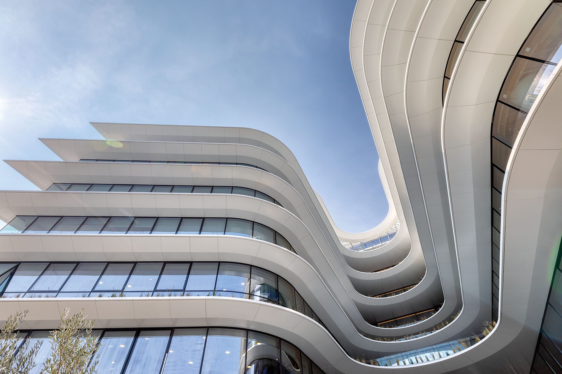 Curved white façade bands of The Orbit in Athens by Lianou Chalvatzis Architects