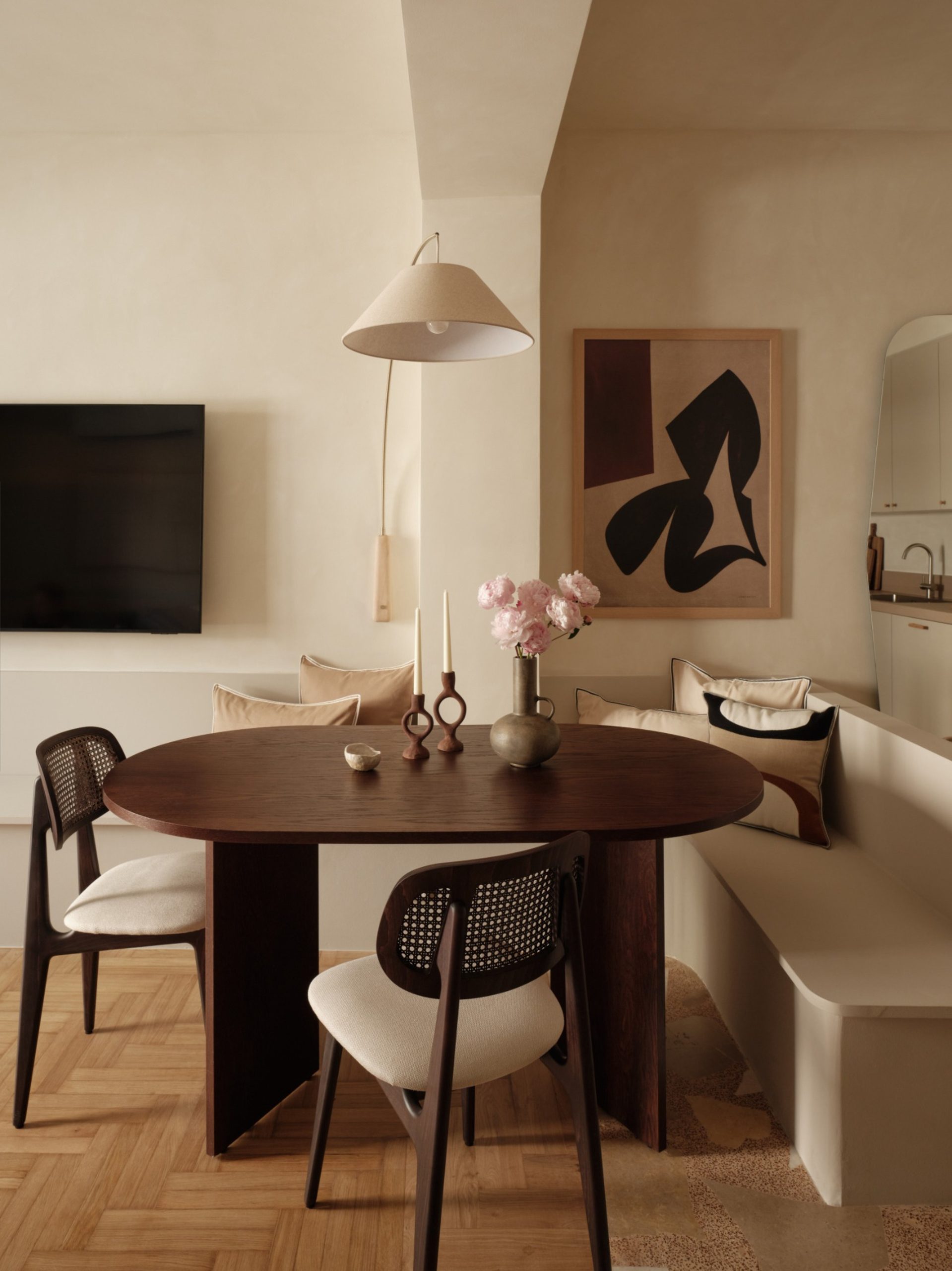 Thiseio Residence integrated bench combining seating and storage beside dining table