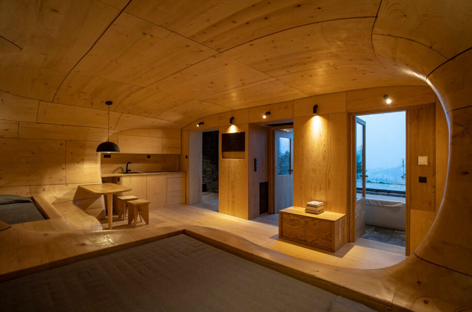 Wooden interior opening towards the entrance at The Wooden Cave