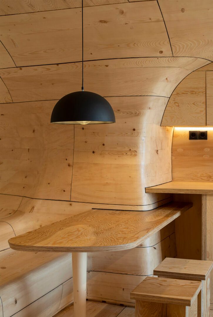 Built-in timber table and bench in The Wooden Cave