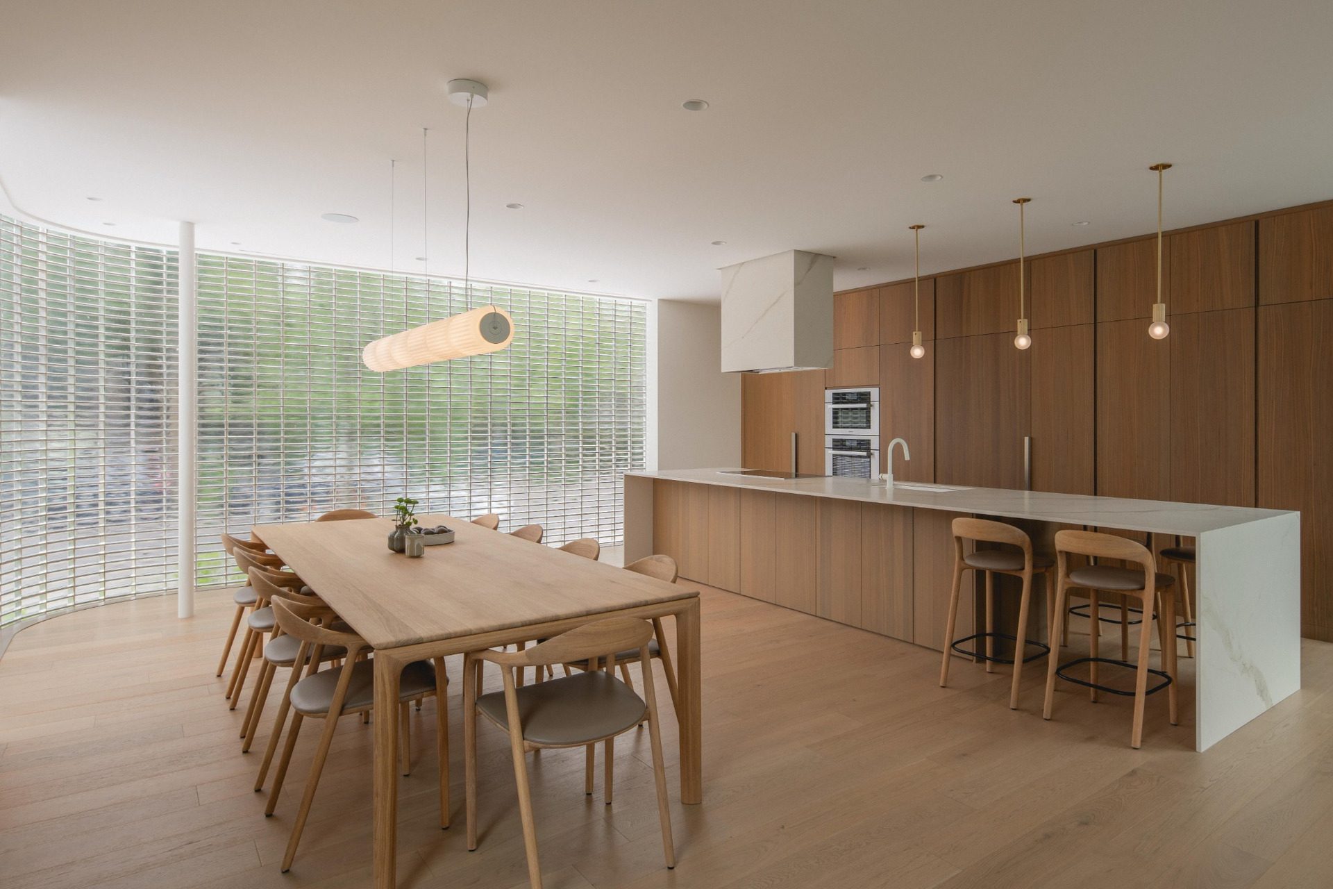 Kitchen and dining area lit through the glass-block wall at The Lens