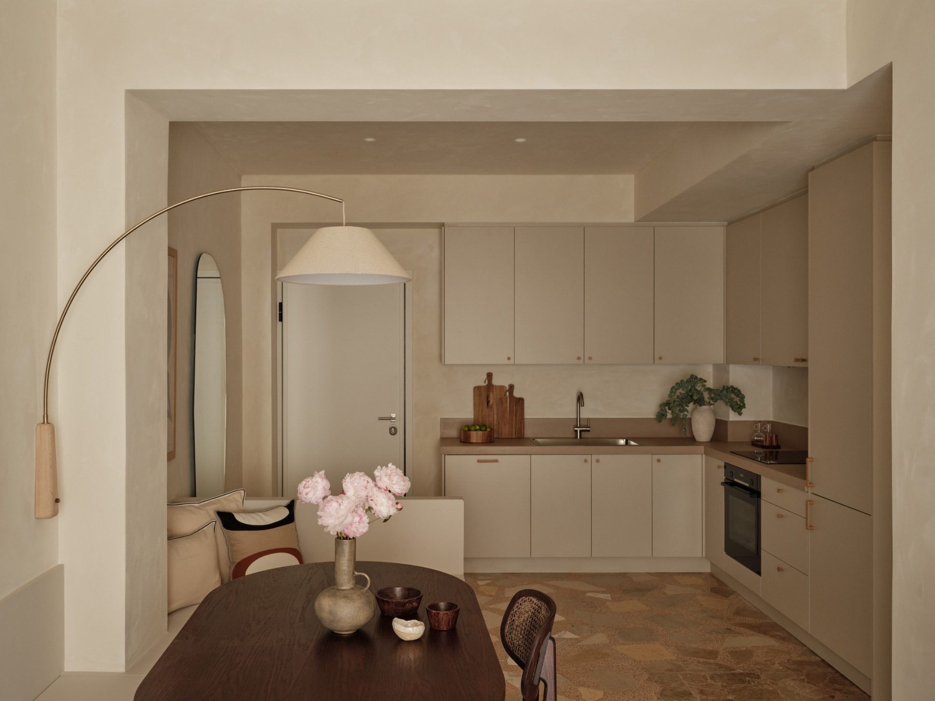 Thiseio Residence kitchen with microcement counters and dining table