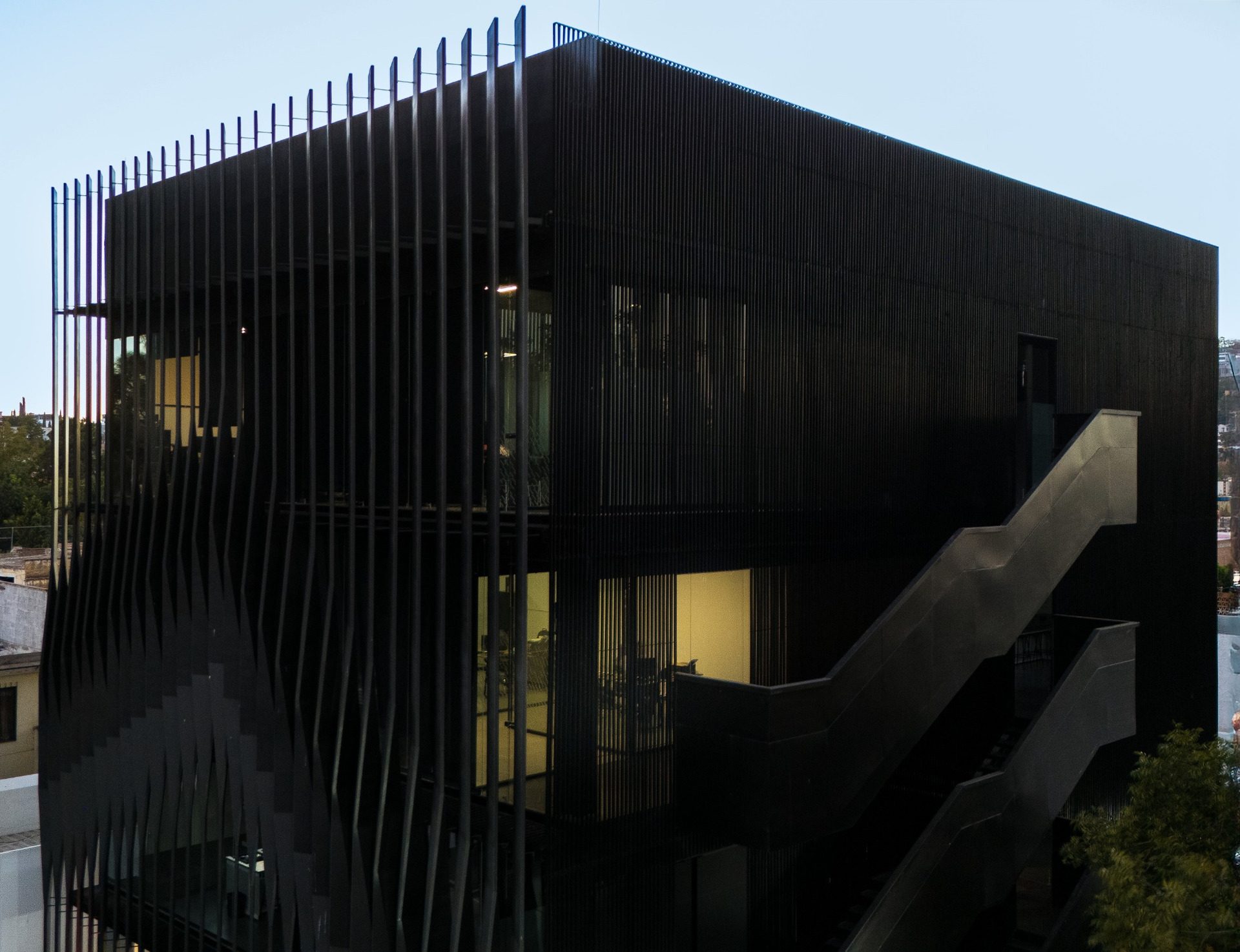 Torre Negra corner with suspended staircase and screened façade