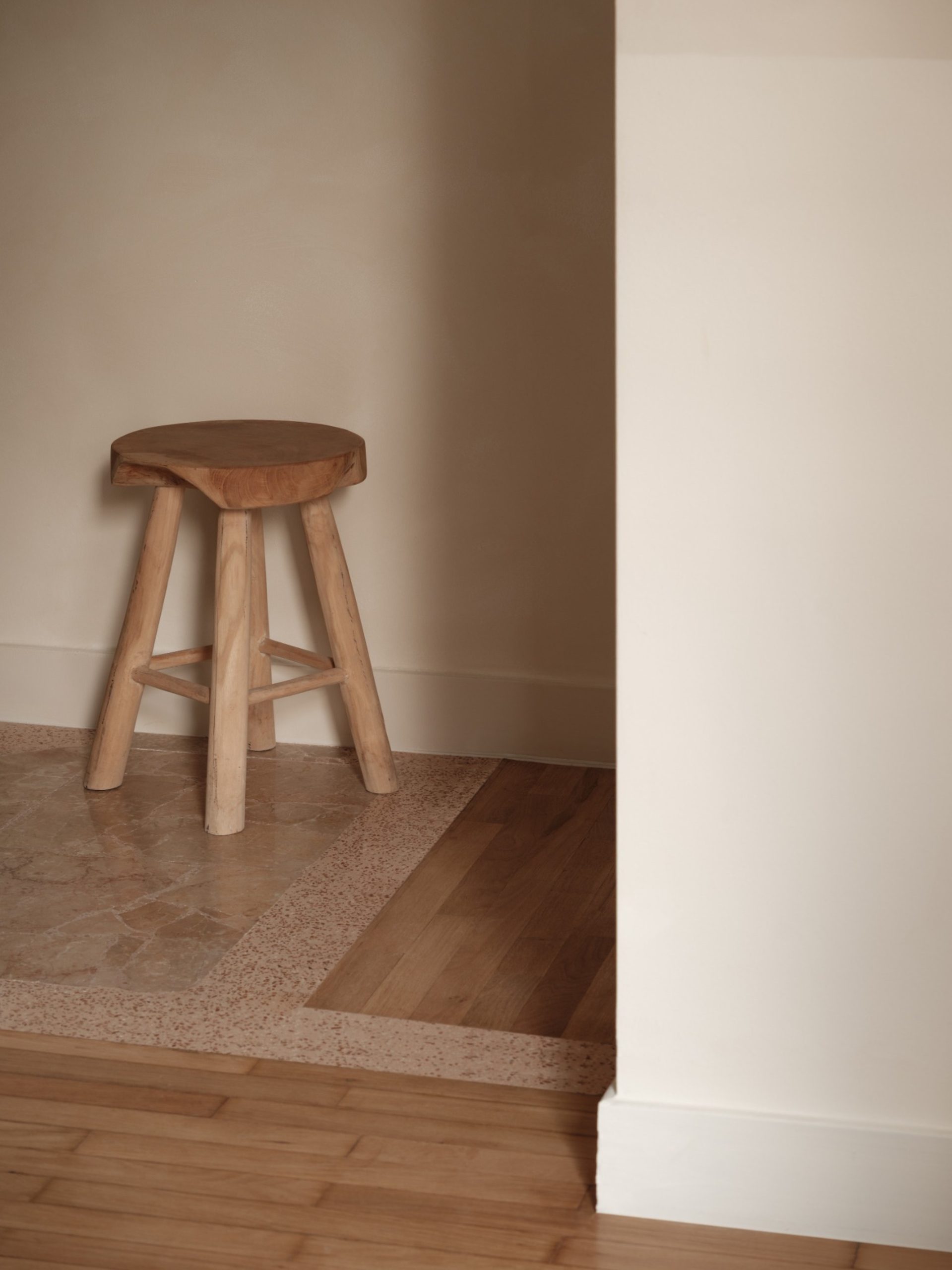 Thiseio Residence threshold where restored parquet meets new palladiana