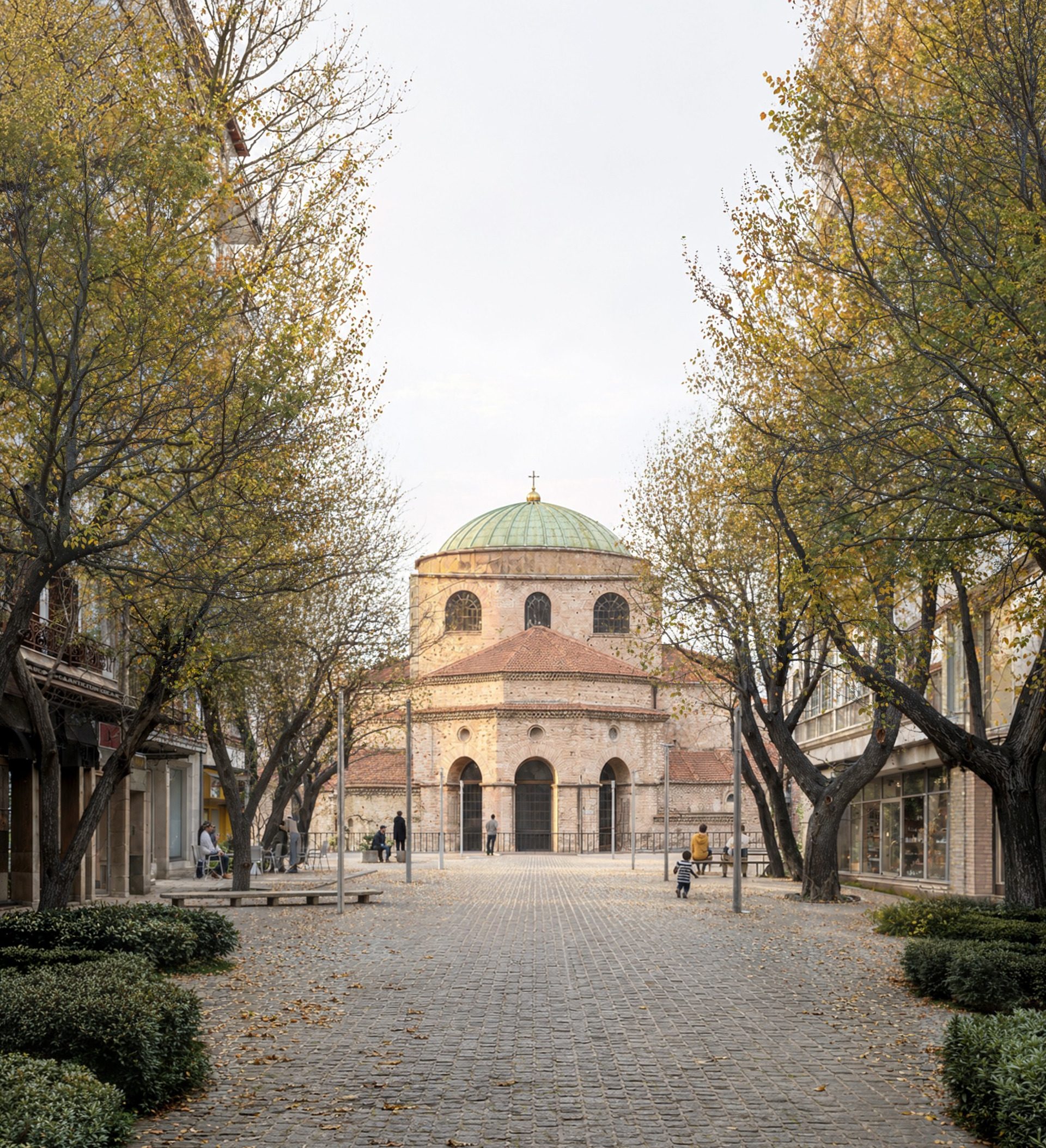 Tree-lined pedestrian route towards a domed monument in the Armosi masterplan