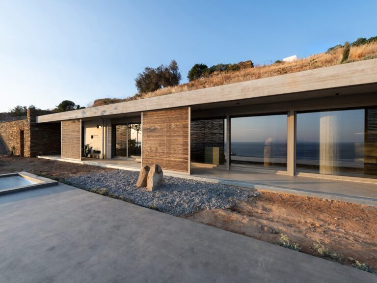 West façade of residence A of The Passage with planted roof and bamboo screens