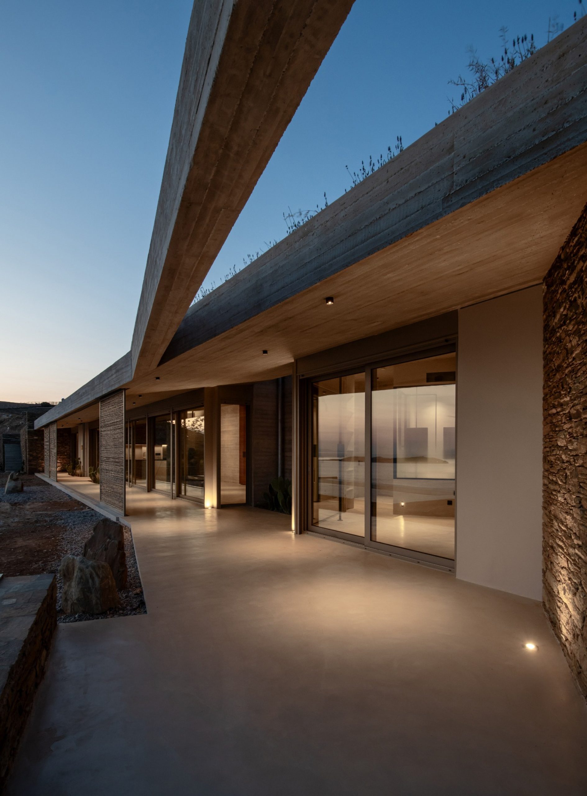 Semi-outdoor space along the west façade of residence A in Andros