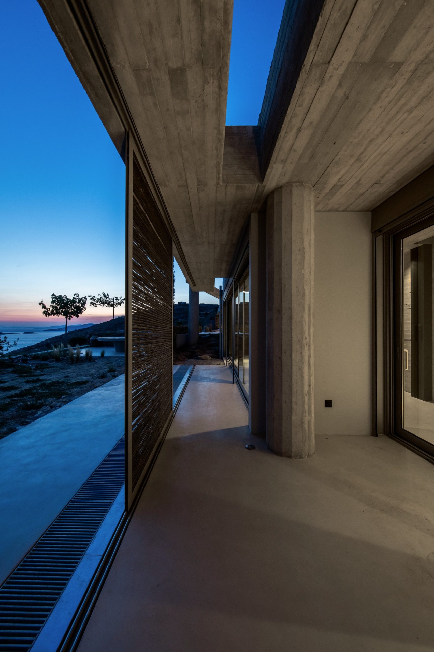 Semi-outdoor corridor of residence C of The Passage at sunset
