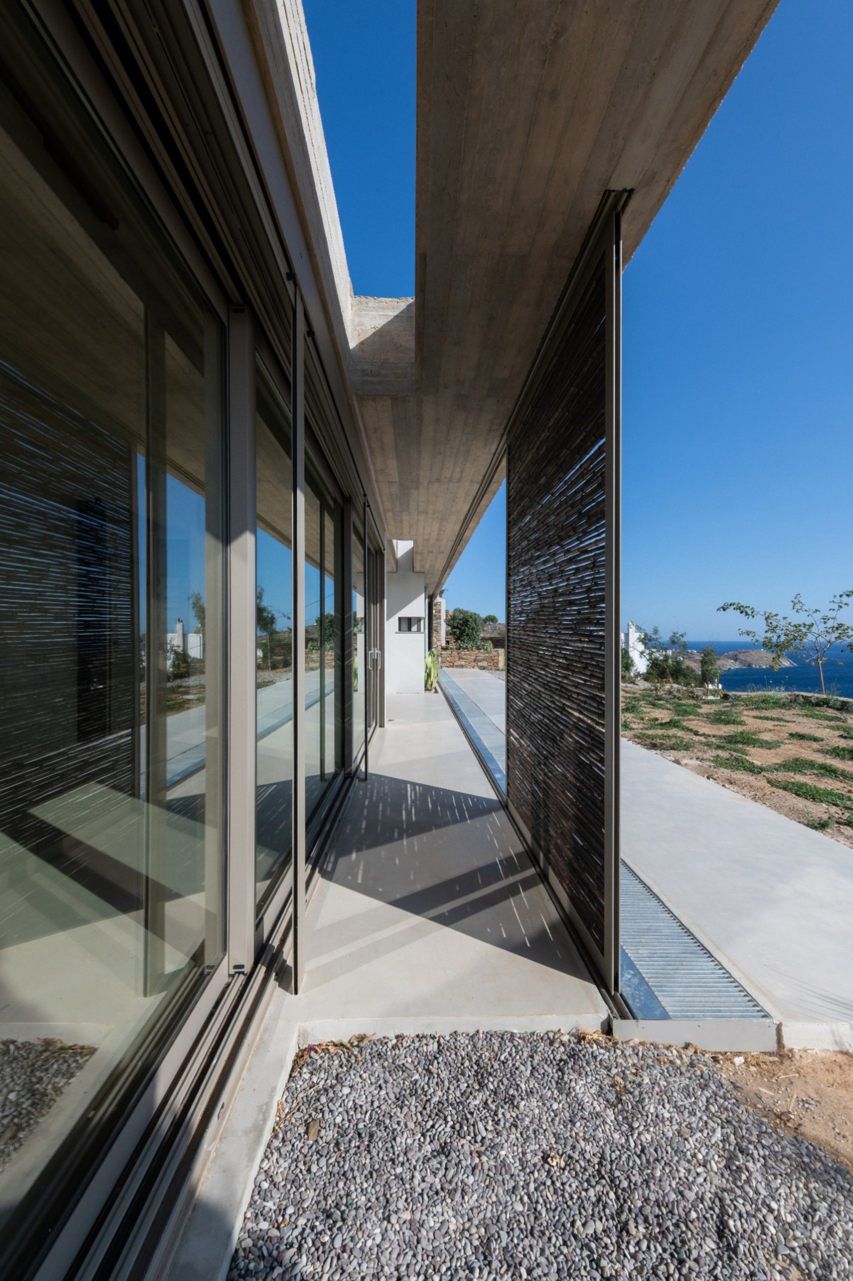 Glazed west façade and semi-outdoor space of residence C of The Passage