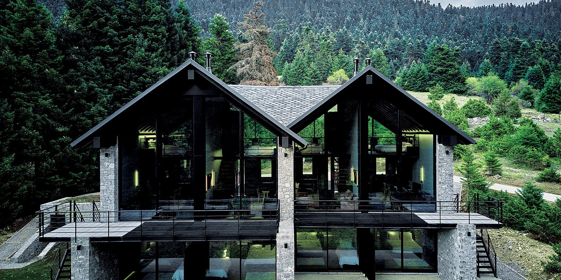 Hermitage 1310 two pitched-roof volumes against the Parnassos fir forest