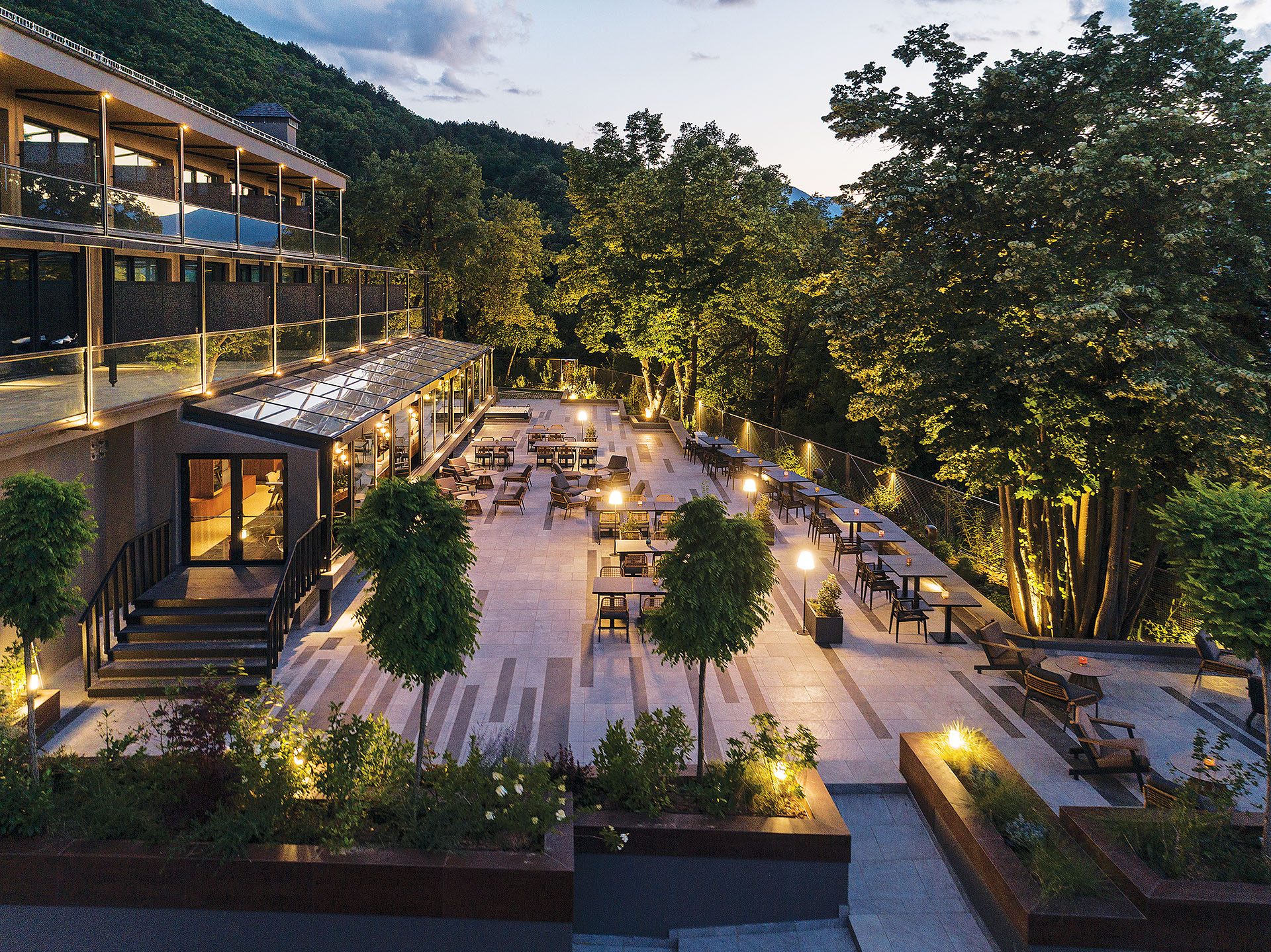 Terraces with linear planters and lighting at The Lynx Mountain Resort