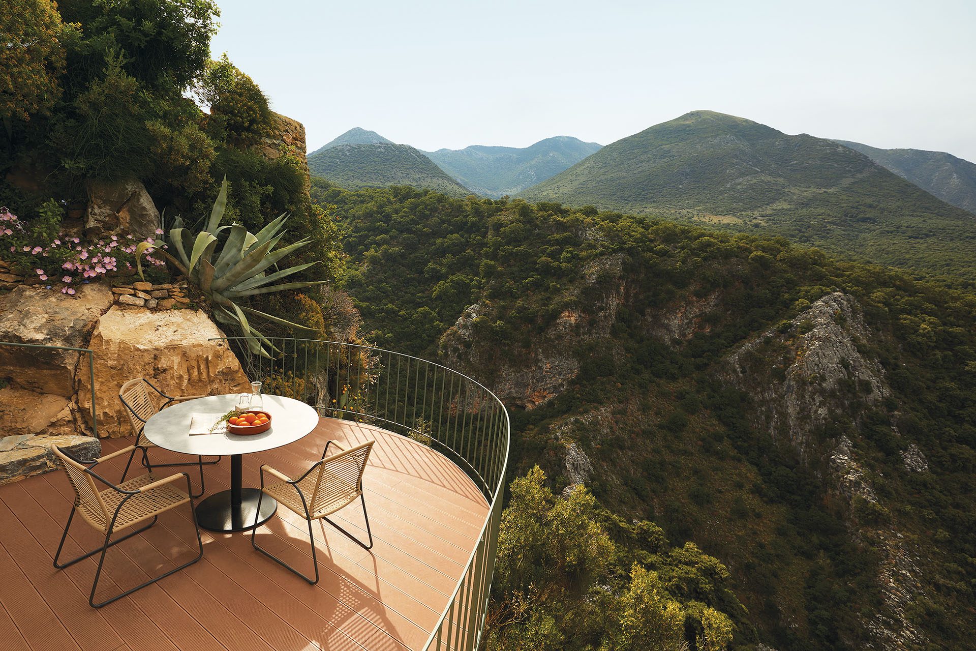 Timber terrace with table overlooking the gorge at Paratiritirio