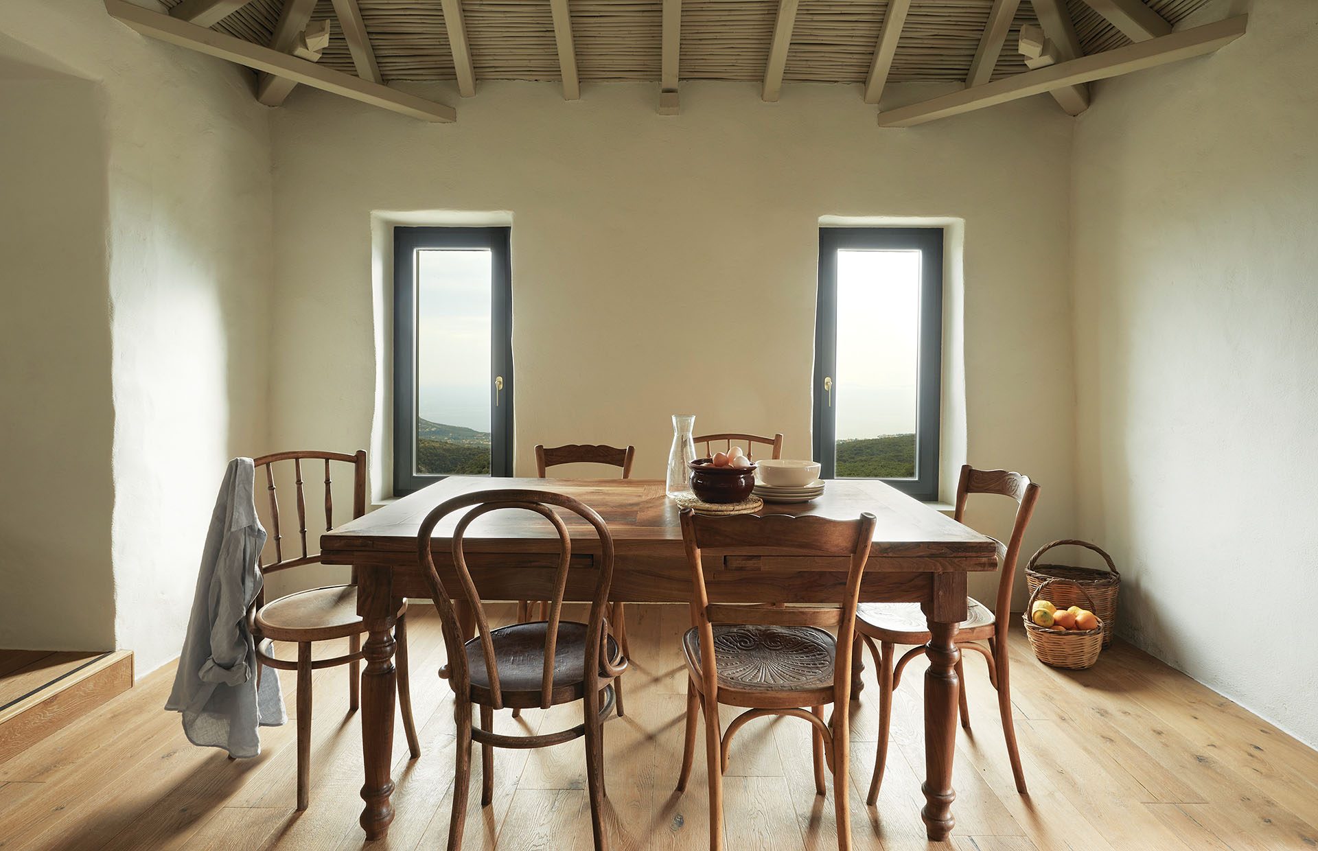 Dining room with bentwood chairs and timber ceiling at Paratiritirio