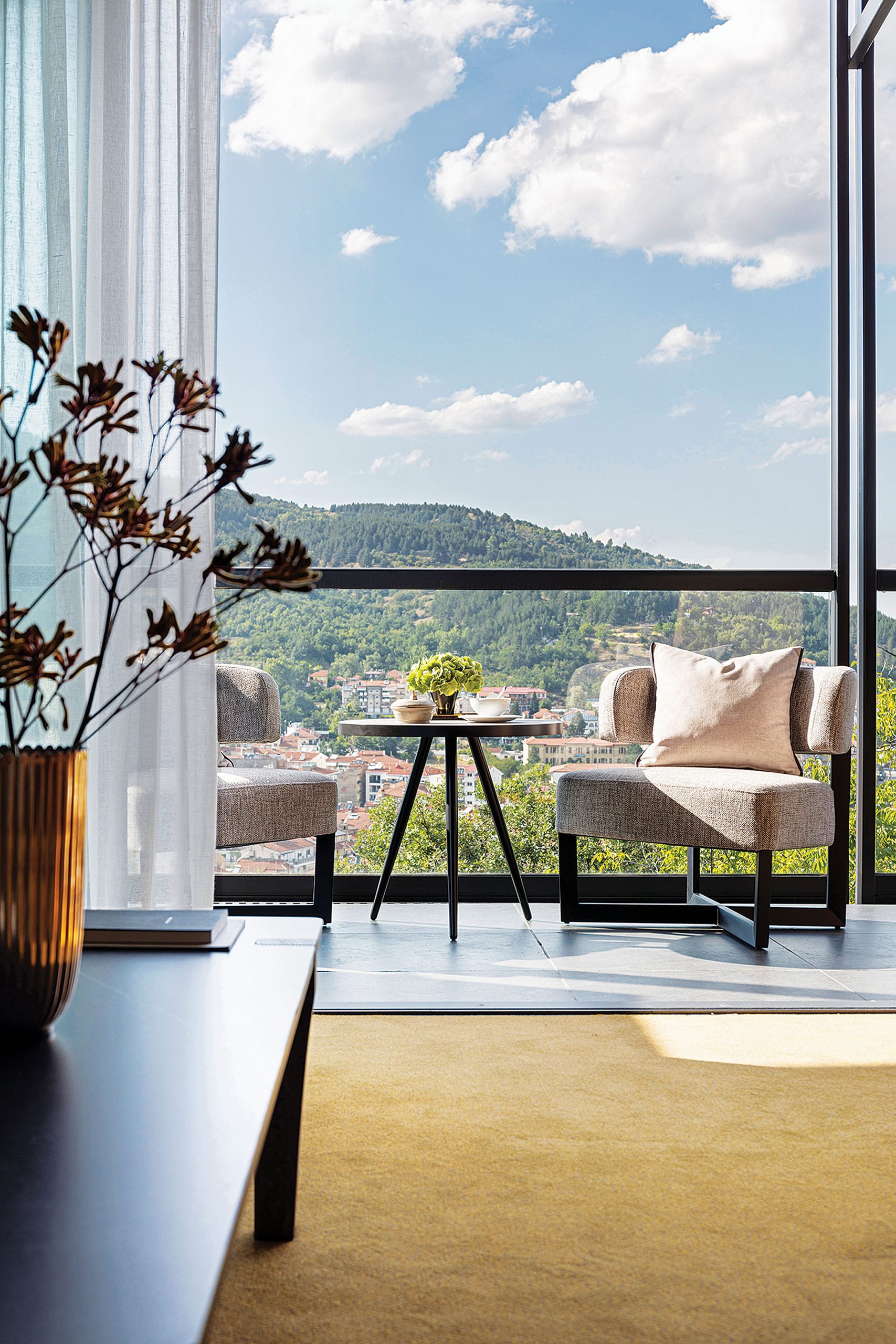 Room corner with glazing and mountain view at The Lynx Mountain Resort
