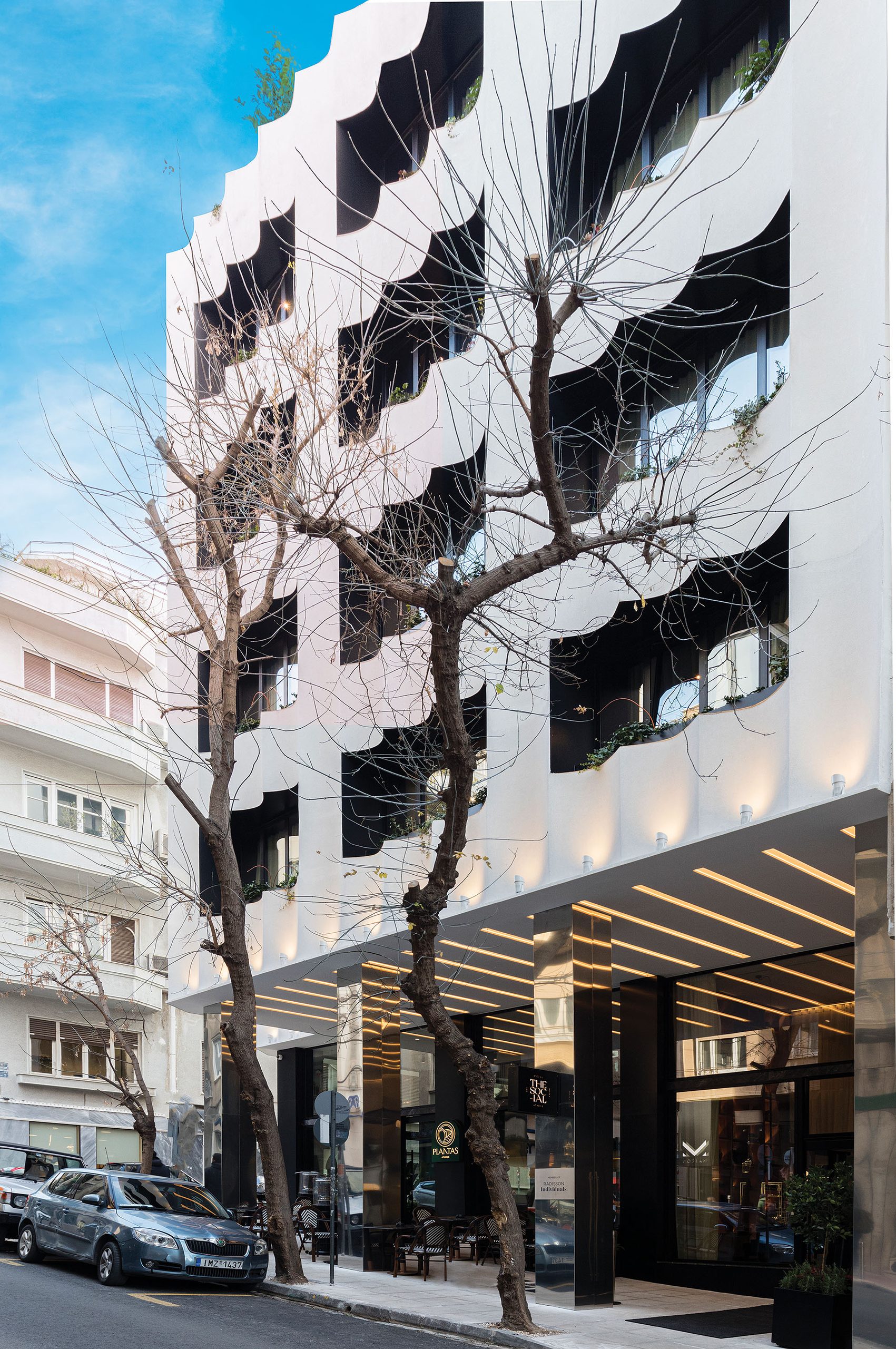 The Social Athens Hotel street façade with planting and ground-floor arcade