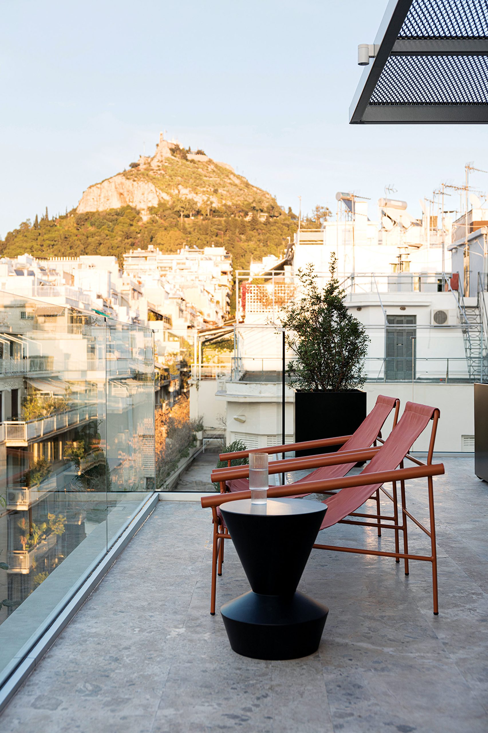 Rooftop terrace of The Social Athens Hotel with view of Lycabettus Hill