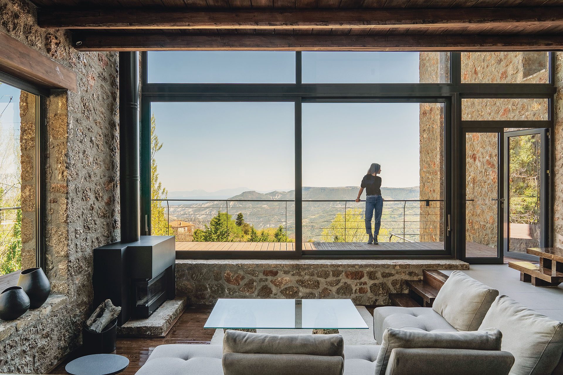 Living room with full-height glazing towards the Corinthian Gulf at Slope