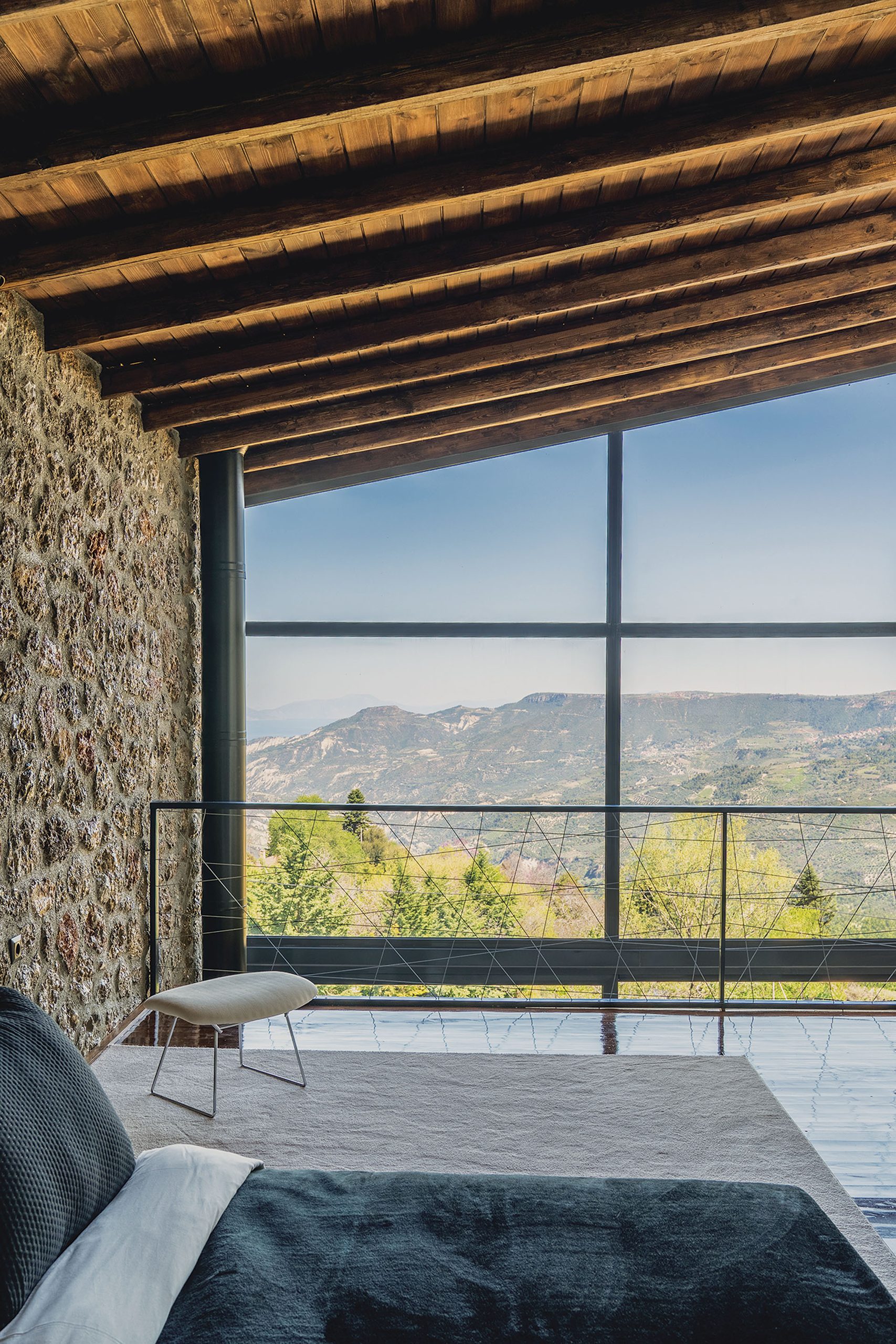 Bedroom under timber ceiling with mountain view at Slope