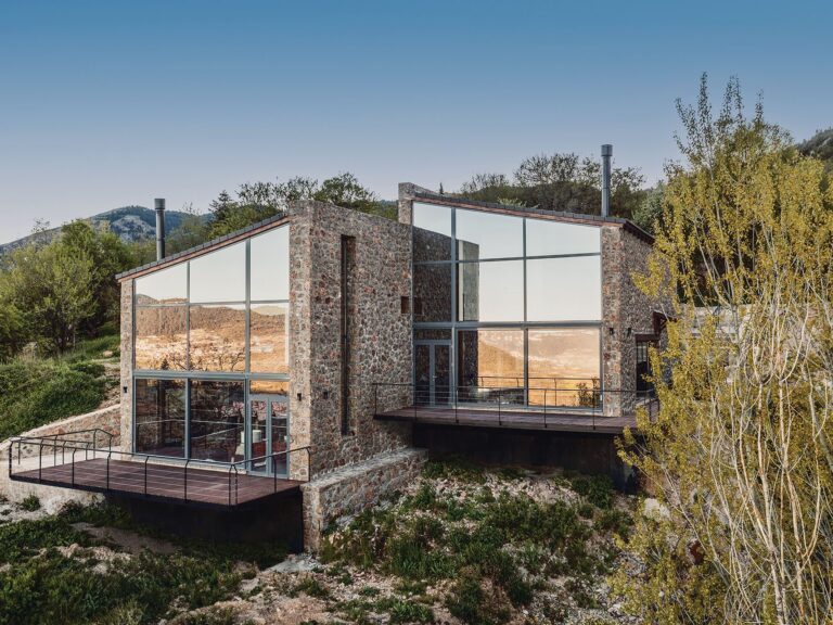 Slope stone residences with glazed gables on a slope in Trikala, Corinthia